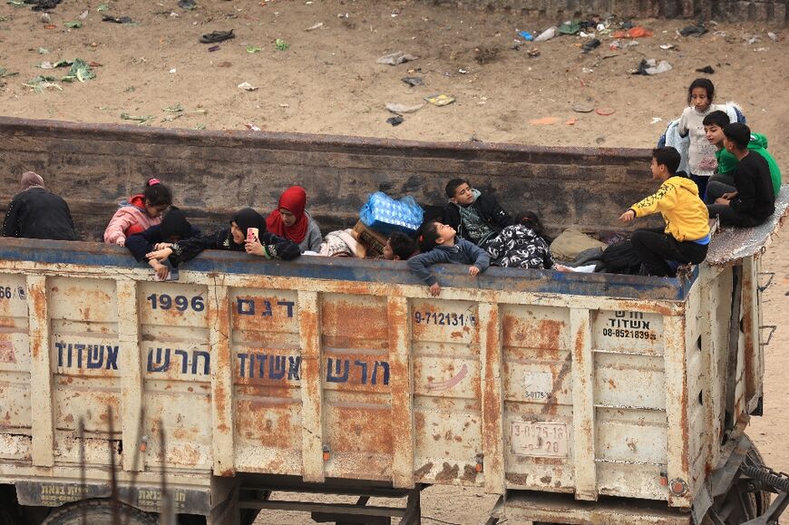 Displaced Palestinians arrive in Rafah in the far south of the Gaza Strip