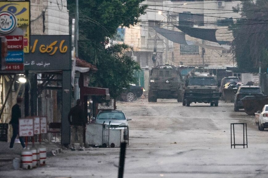 Israeli armoured vehicles seen during a raid at the Jenin refugee camp in the occupied West Bank on December 5, 2023