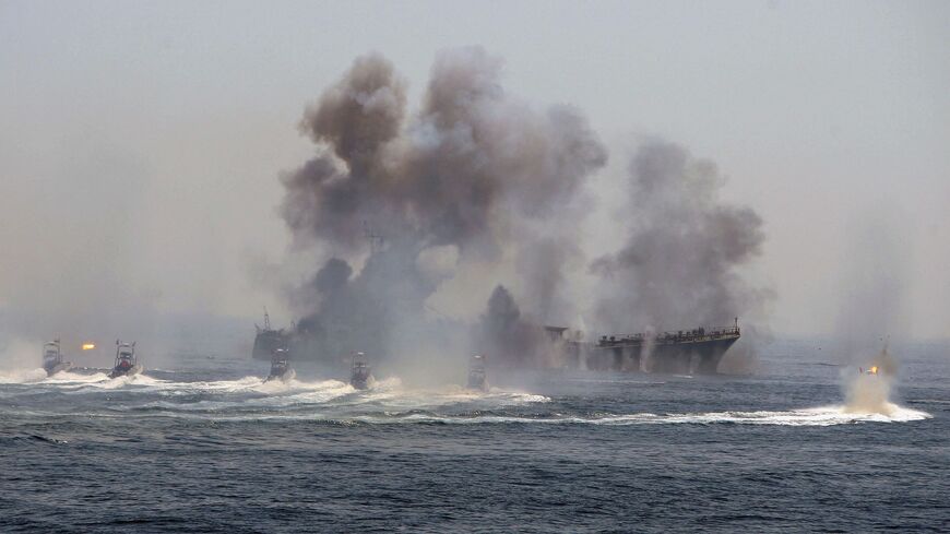 Iran's elite Revolutionary Guard boats attack a naval vessel during a three-day military drill in the Gulf on April 22, 2010.