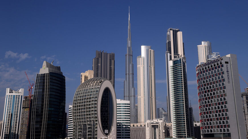 The Burj Khalifa (C) stands surrounded by other skyscrapers in Dubai, United Arab Emirates, Nov. 29, 2020.