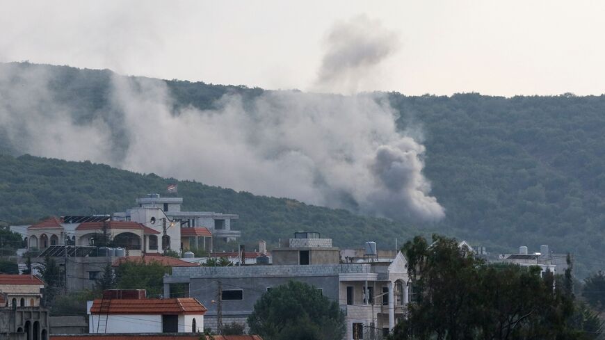 Smoke billows following Israeli artillery bombing on the outskirts of the Lebanese border village of Aita al-Shaab, from an Israeli military position overlooking the area, Oct. 9, 2023. 