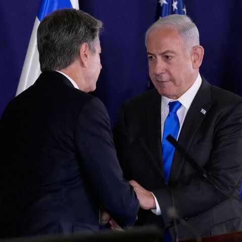 Israeli Prime Minister Benjamin Netanyahu (R) shakes hands with US Secretary of State Antony Blinken during statements to the media inside The Kirya, which houses the Israeli Defence Ministry, after their meeting in Tel Aviv on October 12, 2023. Blinken arrived in a show of solidarity after Hamas's surprise weekend onslaught in Israel, an AFP correspondent travelling with him reported. He is expected to visit Israeli Prime Minister Benjamin Netanyahu as Washington closes ranks with its ally that has launche