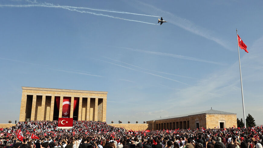 The Soloturk aerobatic demonstration team of the Turkish Air Force flies an F-16 aircraft over Anitkabir, the mausoleum of Turkish Republic's Founder Mustafa Kemal Ataturk, during celebrations to mark the 100th anniversary of the Republic of Turkey in Ankara, on October 29, 2023. Turkey marked its centenary as a post-Ottoman republic on October 29, 2023, with somewhat muted celebrations held in the shadow of Israel's escalating war with Hamas militants in Gaza. (Photo by Adem ALTAN / AFP) (Photo by ADEM ALT