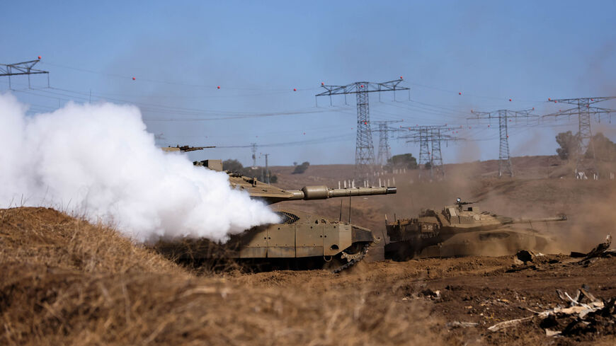 Israeli military tanks take up a position during a drill in the annexed Golan Heights, amid increasing cross-border tensions between Hezbollah and Israel as fighting continues in the south with Hamas in the Gaza Strip, Nov. 9, 2023.