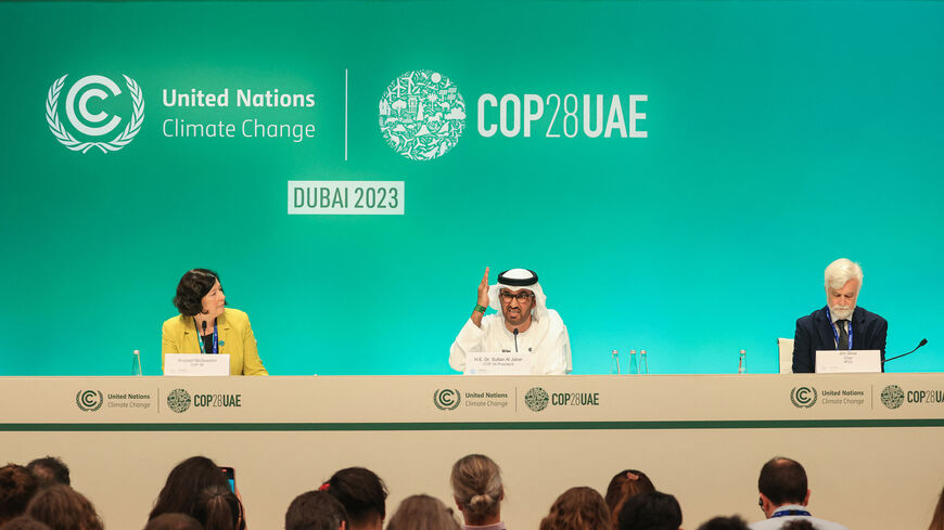 COP28 President Sultan Ahmed Al Jaber (C), Chair of the Intergovernmental Panel on Climate Change Jim Skea (R) and COP28 Director of Communications Sconaid McGeachin (L) attend a press conference at the United Nations climate summit in Dubai, United Arab Emirates, Dec. 4, 2023.