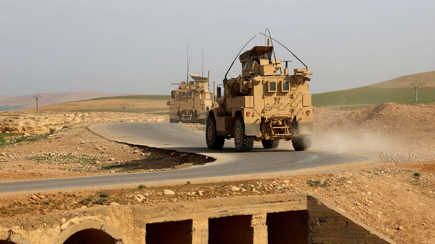 US-made armoured vehicles bearing markings of the US Marine Corps are seen on a road north of Raqa in northern Syria on March 27, 2017. US-backed forces battled the Islamic State group around a key Syrian town, after the capture of an airbase brought them closer to besieging the jihadists in their stronghold Raqa.Operations are currently focused on the strategically important town of Tabqa on the Euphrates River, and the adjacent dam and military airport. / AFP PHOTO / DELIL SOULEIMAN (Photo credit should r